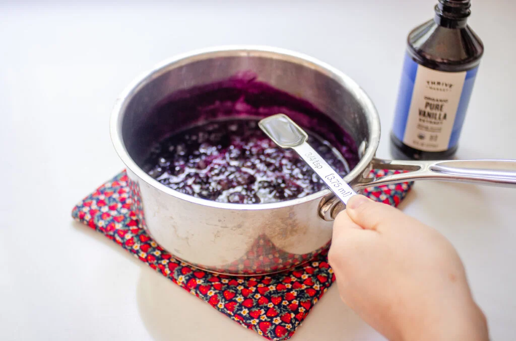 Adding the vanilla extract off the heat.