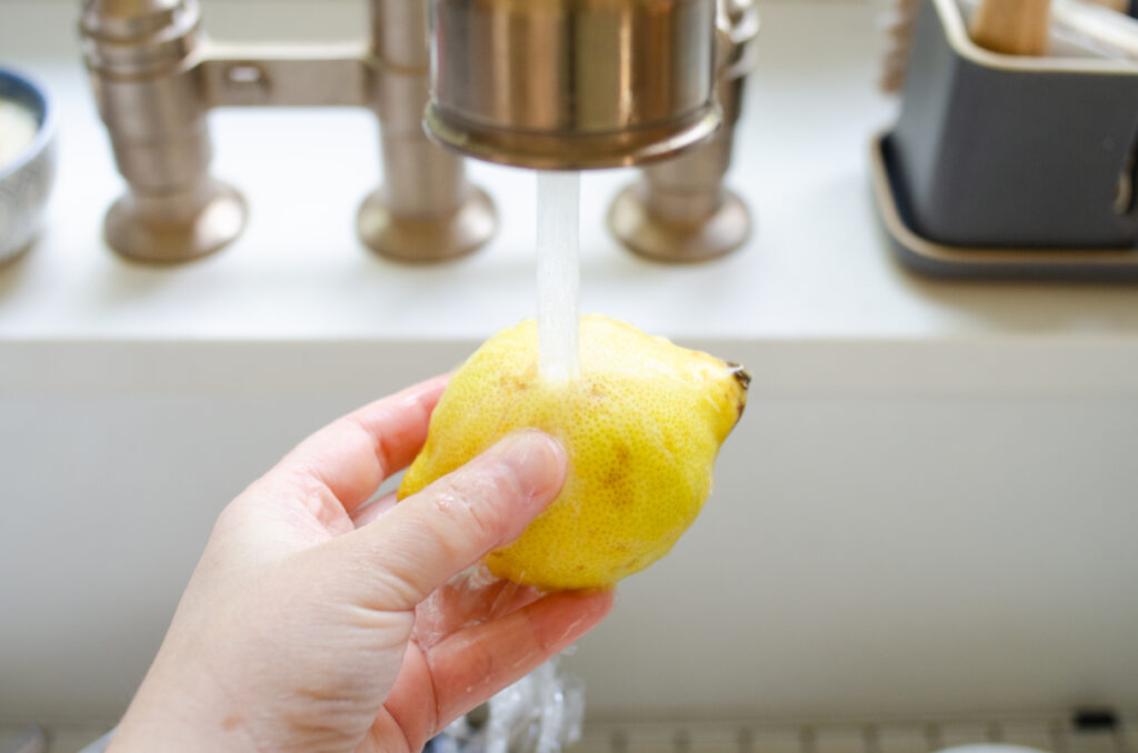 Washing a lemon.