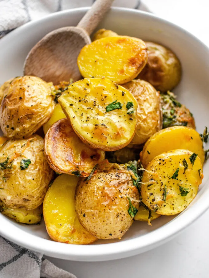 Elevated Roasted Little Potatoes with fresh herbs, lemon, garlic, and parmesan cheese.