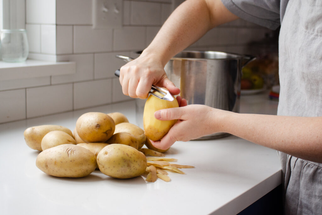 Peeling potatoes. 