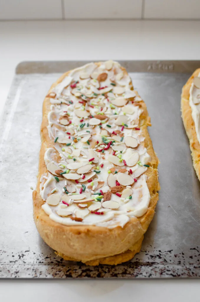 Adding colorful sprinkles as well as the sliced almonds.