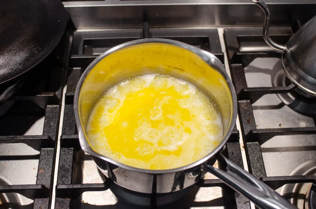 Boiling the butter and water for the short crust pastry.