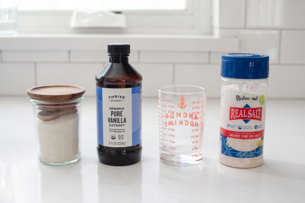 All of the ingredients needed to make a single serving of vanilla syrup substitute.