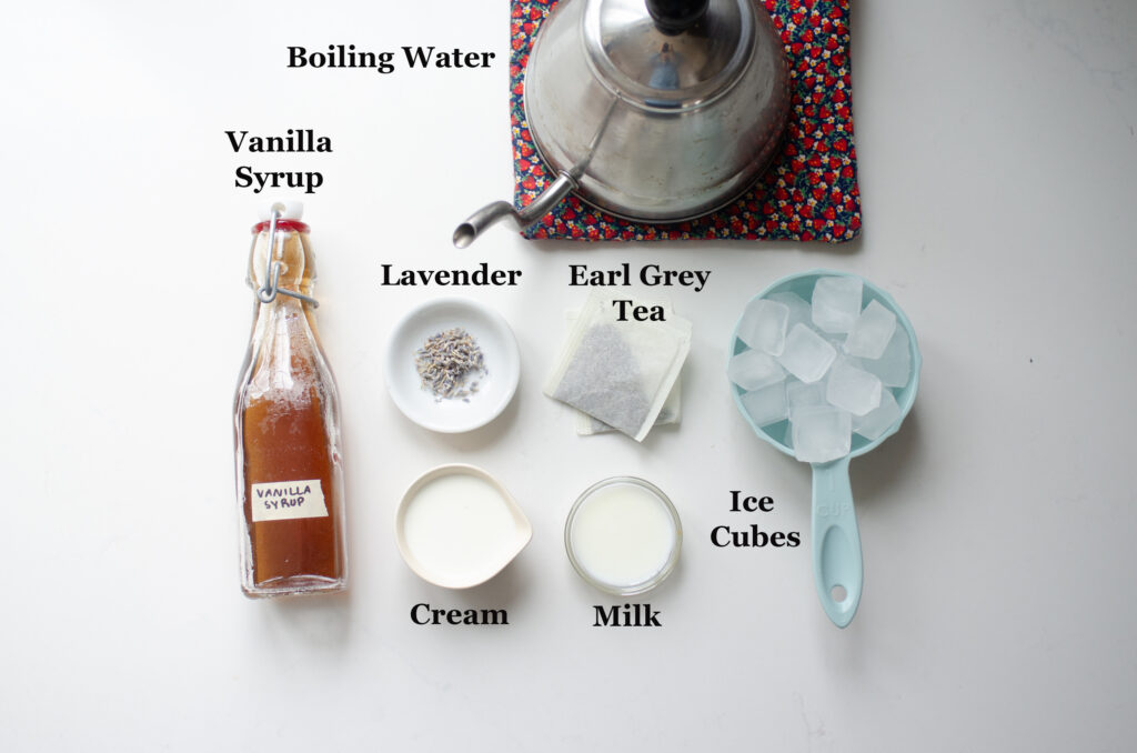 All of the ingredients to make an iced Earl Grey with sweet cream cold foam.