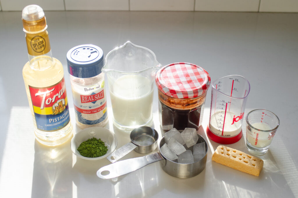 All of the ingredients needed to make the simple version of the Starbucks Iced Dubai Chocolate Matcha Latte.