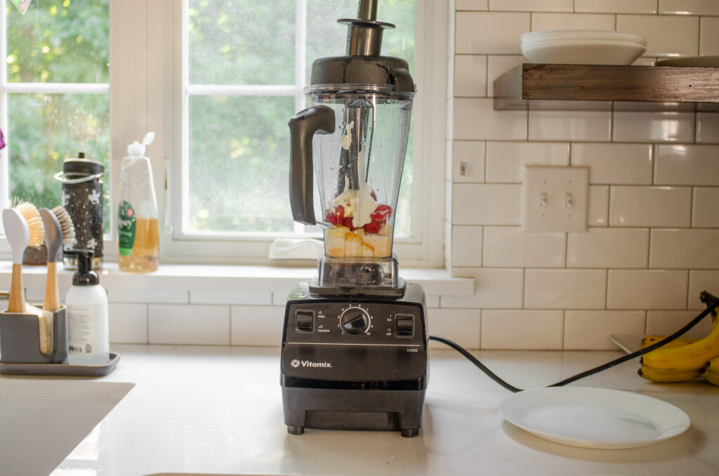 All of the ingredients added to a blender. 