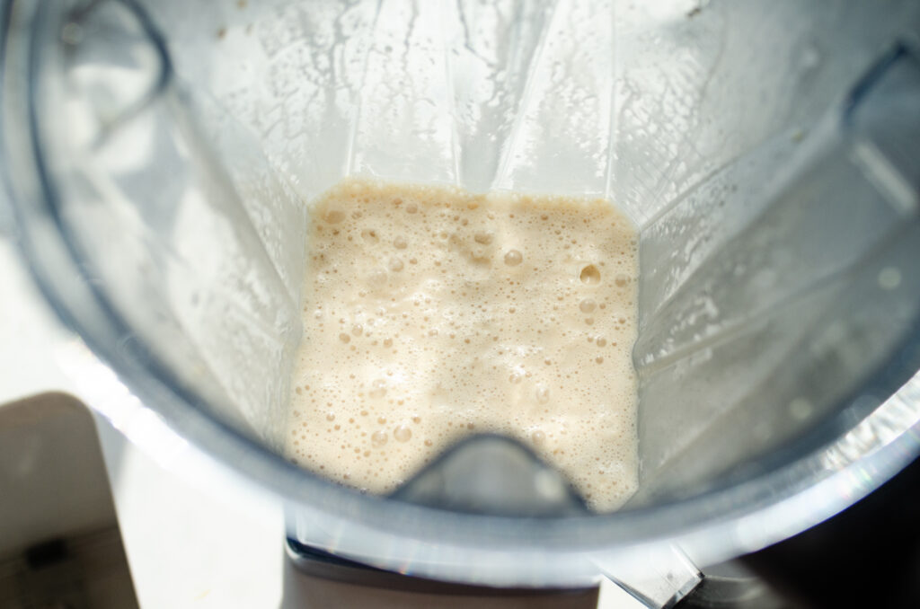 The blended coffee Frappuccino in the blender pitcher to show the texture.