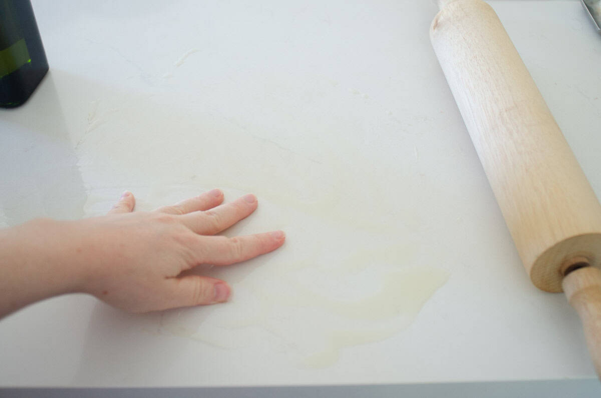 Greasing the work surface.